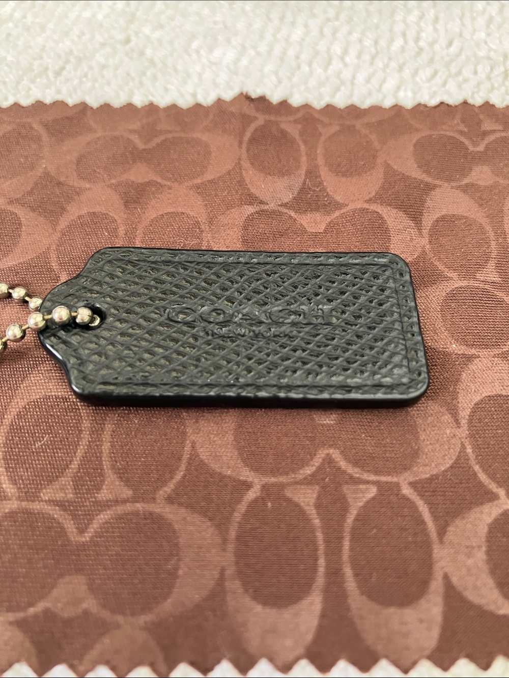 Coach black pebbled leather hang tag 1-1/2”